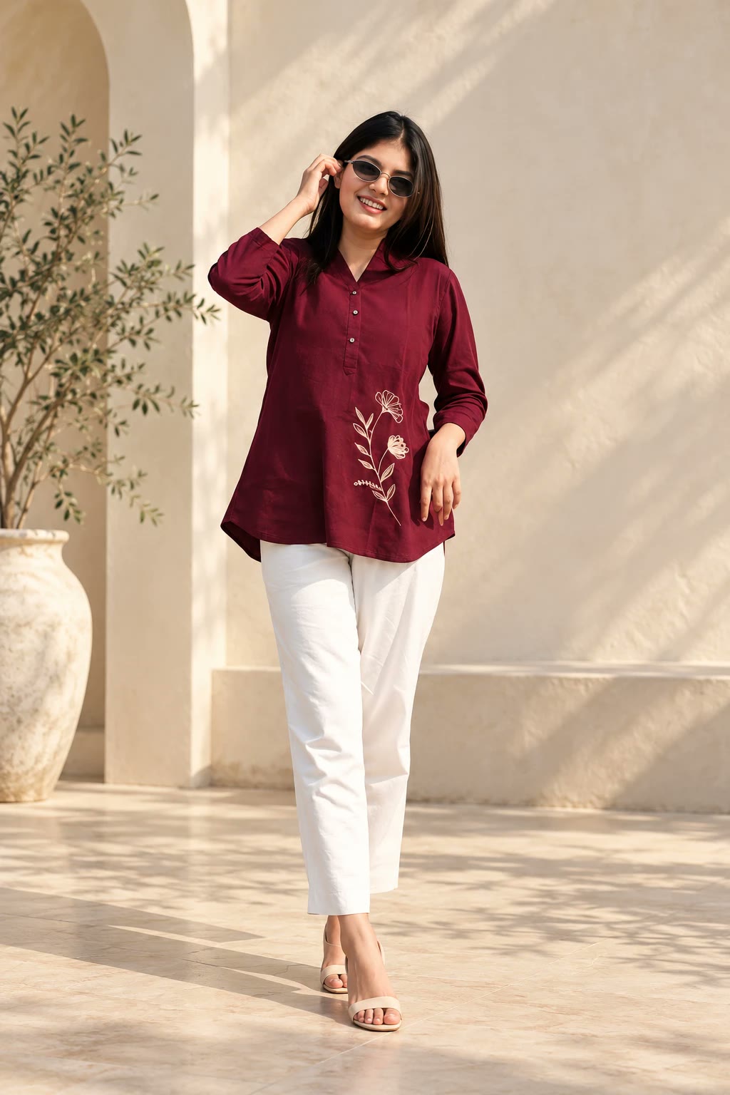 Maroon cotton slub shirt-style kurti with floral motif, worn with cream pants